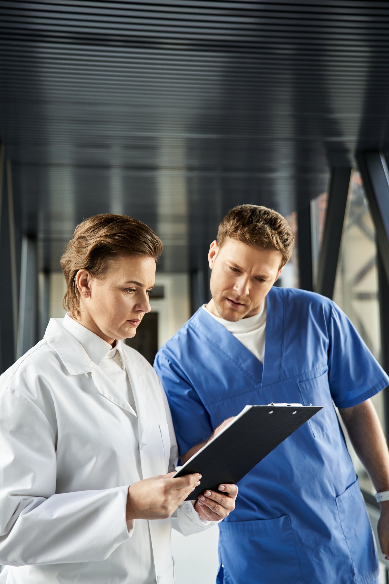Doctors work together in hospital hallway